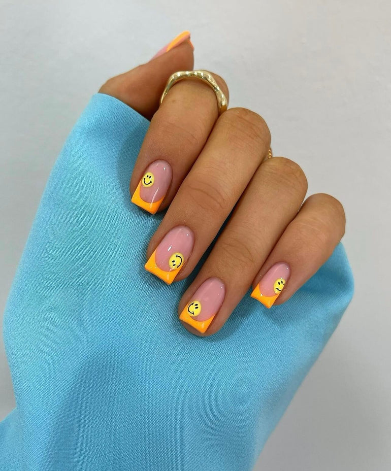 Smiley face nail art with square tangerine tips by Joely Frain