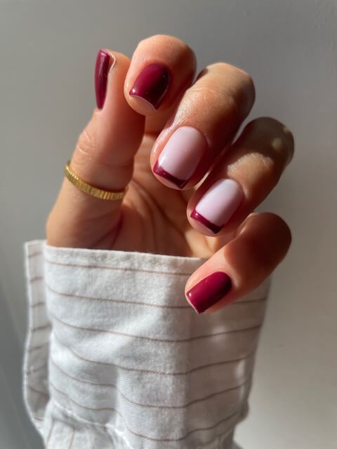 Alternating deep pink and light pink French manicure by Chloe Boyce