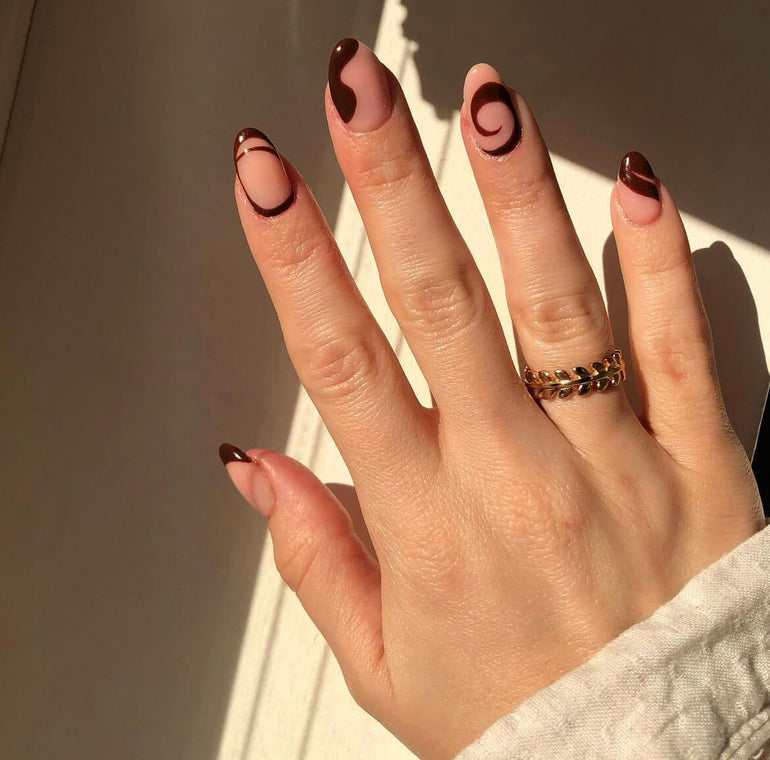 Deep maroon swirling nail art by Danielle Moore