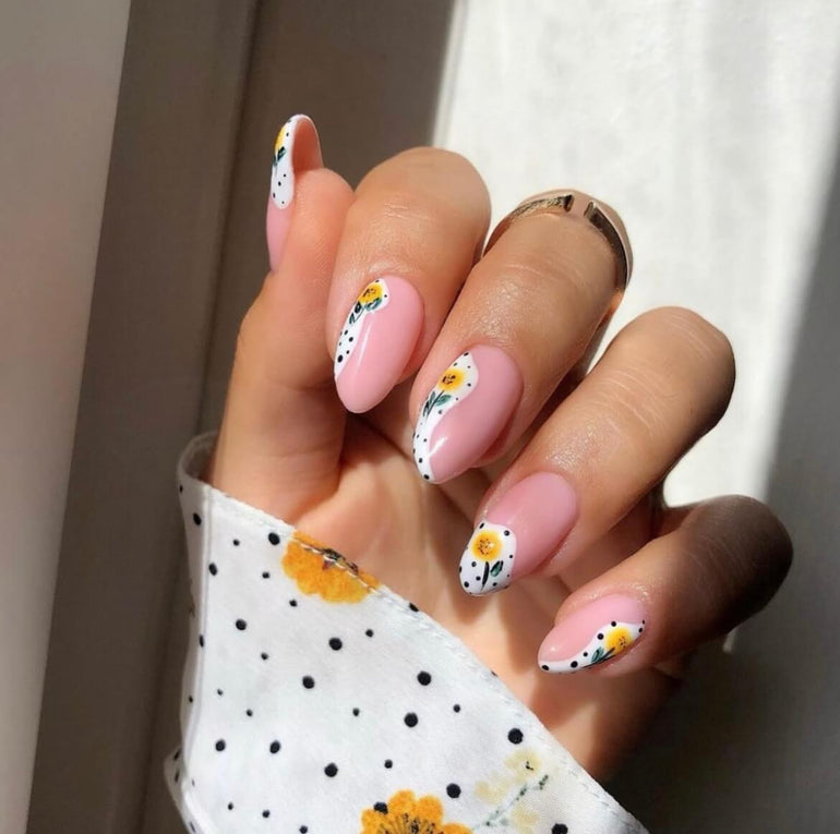 Yellow polka dot flower nail art by Danielle Moore