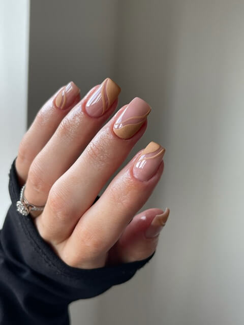 Muted orange swirl gel nails by Suzanne Daggers