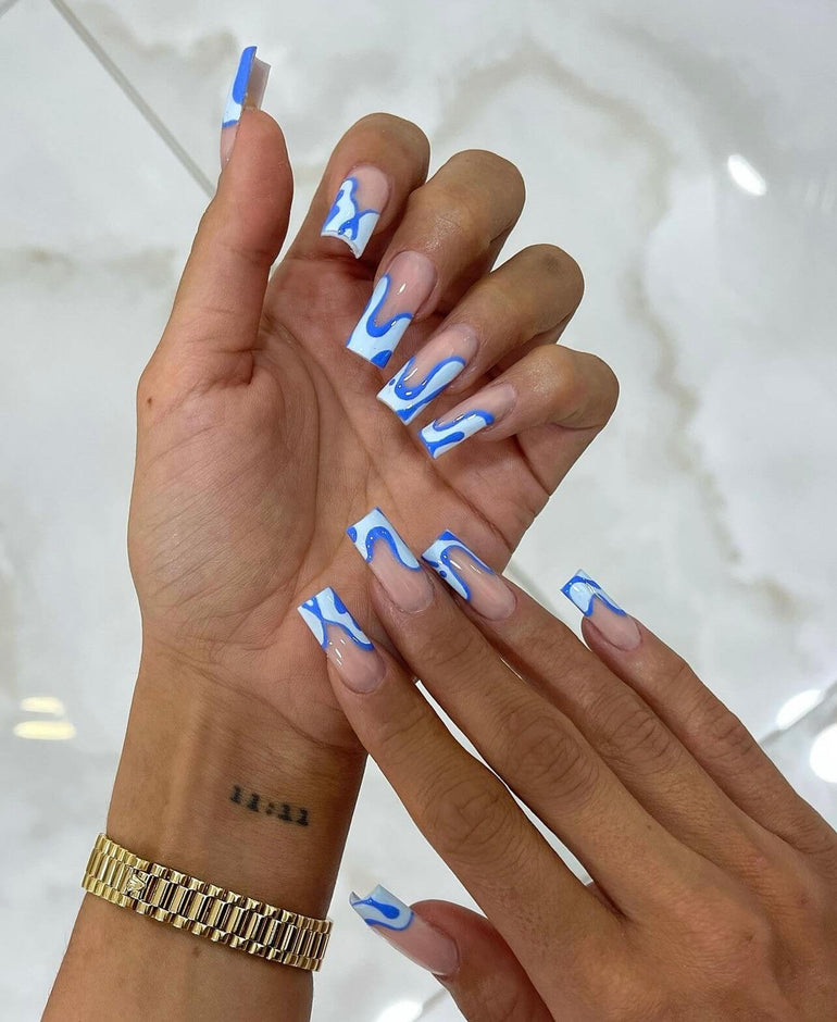 Dark and pastel blue swirl nail art by Joely Frain