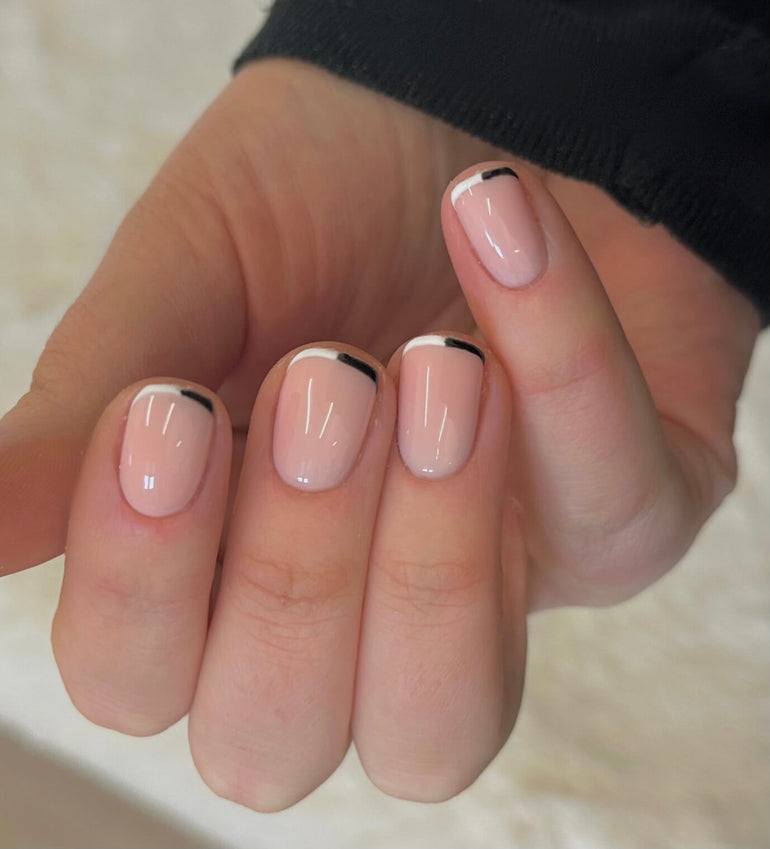 Black and white tip gel nails by Lauren Mcnair