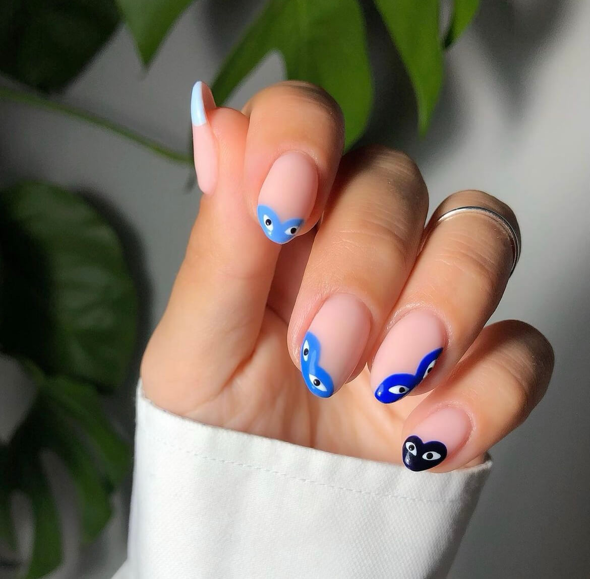 Blue and black eye nail art by Danielle Moore using Glossify