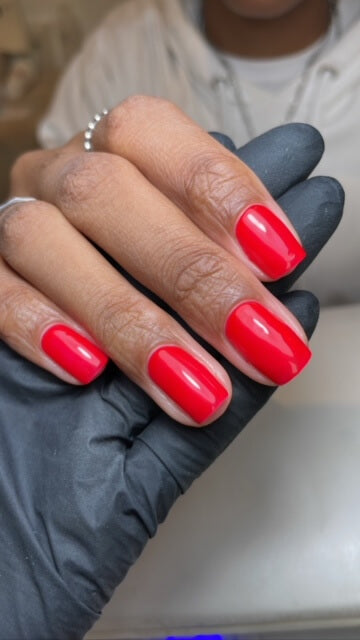 Bright red gel polish by Chloe Boyce