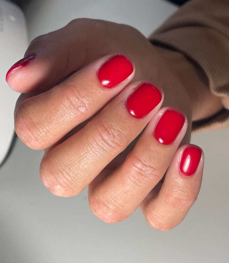 Bright red gel nails by Corrine Jackson