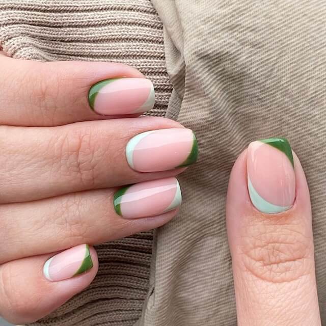 Off-center moss green and pale mint gel tips and cuticles by Kendal Gazal