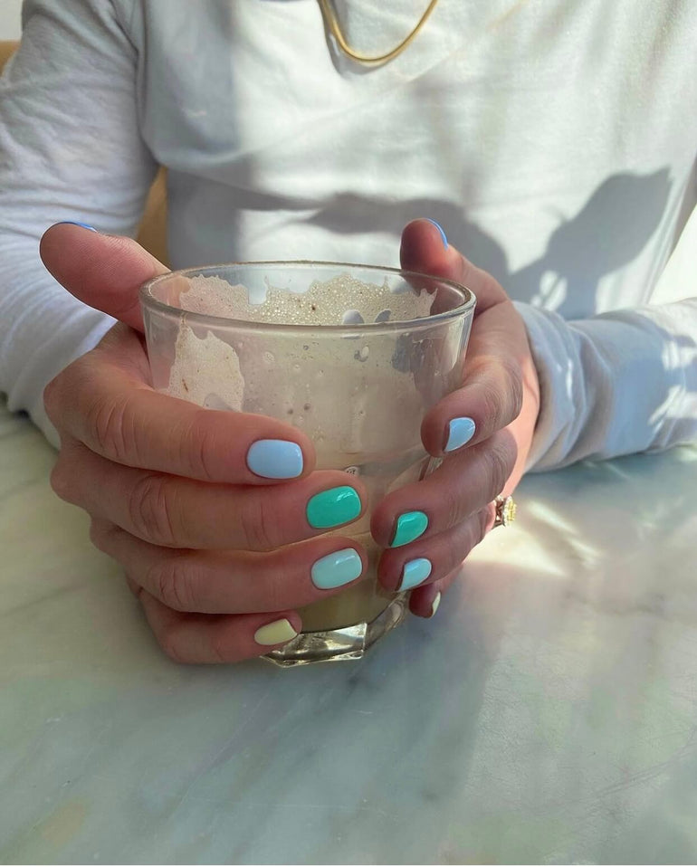 Multicolour gel nails in muted blue and green tones by Ellie O'Hara
