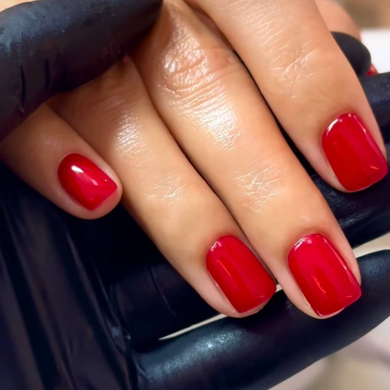 Bright red gel nails by Tori Watterson